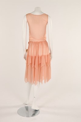 Lot 48 - A pale salmon pink chiffon dress, late 1920s,...