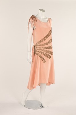 Lot 48 - A pale salmon pink chiffon dress, late 1920s,...