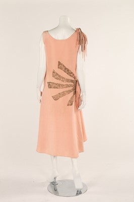 Lot 48 - A pale salmon pink chiffon dress, late 1920s,...