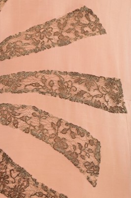 Lot 48 - A pale salmon pink chiffon dress, late 1920s,...