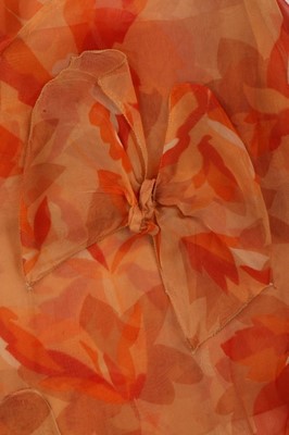Lot 48 - A pale salmon pink chiffon dress, late 1920s,...