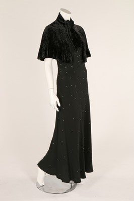 Lot 51 - A 1930s black crepe evening dress with...