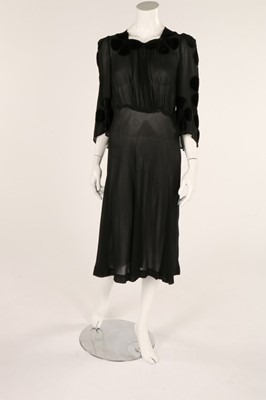 Lot 53 - A black chiffon dress, 1930s, with floral...