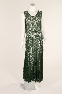 Lot 55 - A green lace bias cut dress, 1930s, bust 96in,...