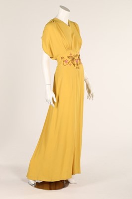 Lot 70 - Two summer evening gowns, 1940s, one of yellow...