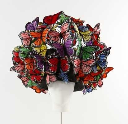 Lot 292 - A Philip Treacy painted feather 'butterfly'...