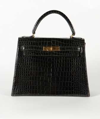 Lot 13 - An Hermès black crocodile Kelly, late 1960s,...