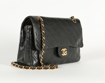 Lot 14 - A Chanel quilted black leather 2.55 bag, 1985,...