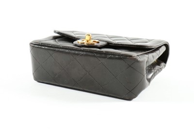 Lot 1 - A Chanel black quilted leather bag, 1990s,...