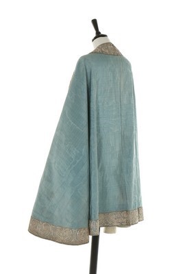 Lot 28 - A fine and rare blue watered silk cape,...