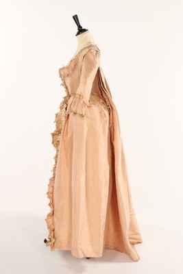 Lot 42 - An old-rose silk robe à la Française, 1770s,...