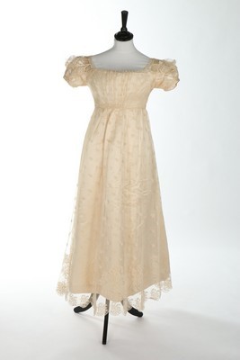 Lot 44 - A needlerun-lace dress, 1820s, with overall...