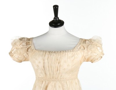 Lot 44 - A needlerun-lace dress, 1820s, with overall...