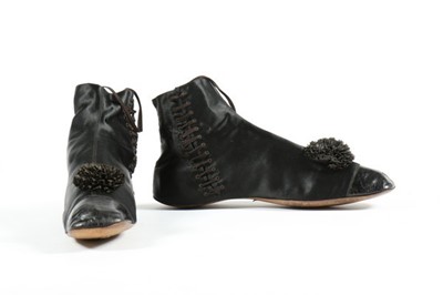 Lot 53 - A pair of black satin ankle boots, circa...