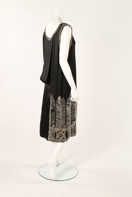 Lot 73 - A Paul Poiret beaded black silk flapper dress,...
