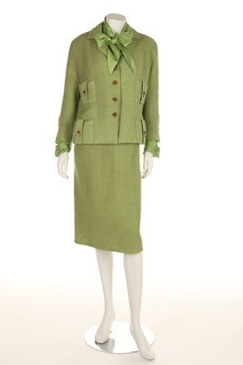 Lot 99 - A Chanel couture classic green wool suit, 1959,...