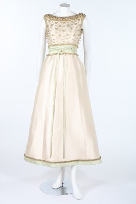 Lot 106 - A Pierre Balmain couture beaded ivory silk...