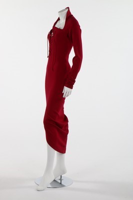 Lot 79 - A Romeo Gigli wine wool jersey dress,...