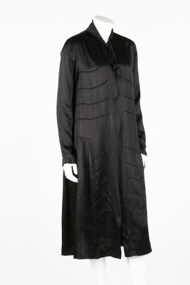 Lot 95 - Two black silk evening coats, one labelled...