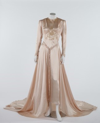 Lot 101 - The pink satin wedding gown worn by Joyce...