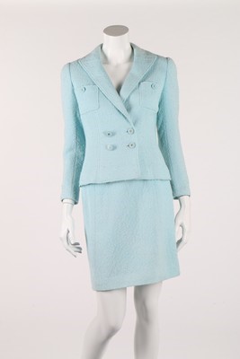 Lot 107 - A Chanel turquoise boucle wool suit, 1997,...