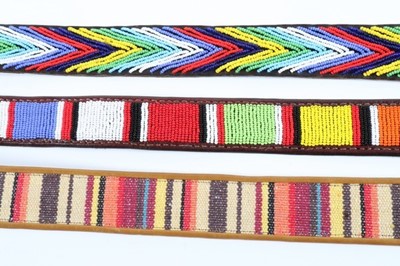 Lot 142 - A good collection of ethnic/hippy style belts,...