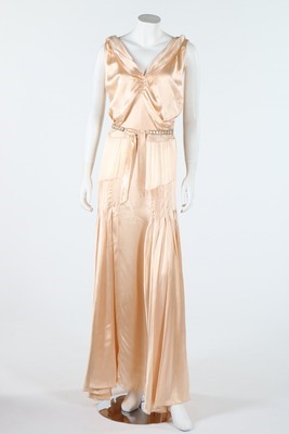 Lot 147 - A couture bias cut oyster satin gown, early...