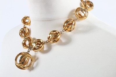 Lot 216 - A Chanel gilt spheres necklace and matching...