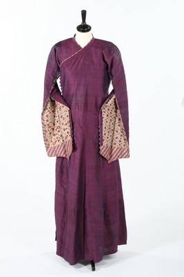 Lot 461 - A woman's purple silk robe, Qajar period,...