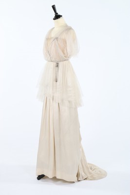 Lot 228 - An ivory tulle and satin evening gown, circa...