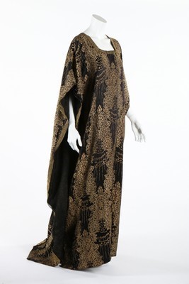 Lot 311 - A black and gold brocaded satin medieval...