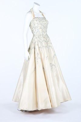 Lot 379 - A lavishly embroidered satin ball gown, mid...