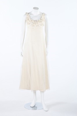 Lot 380 - A Pierre Balmain white tulle and silk gown,...