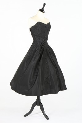 Lot 384 - A Dior London black faille dinner dress, circa...