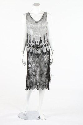 Lot 393 - A beaded tunic style flapper dress, late 1920s,...