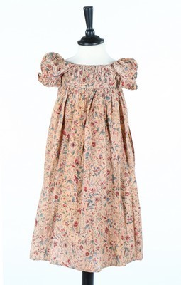 Lot 414 - Printed cotton infant dresses and pinafores,...