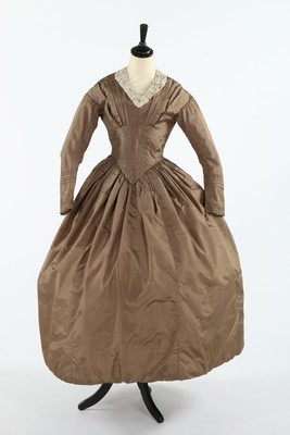 Lot 416 - A good snuff-brown taffeta day dress, 1840s,...