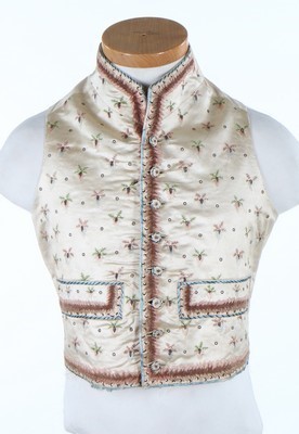 Lot 401 - An embroidered ivory satin waistcoat for a boy...