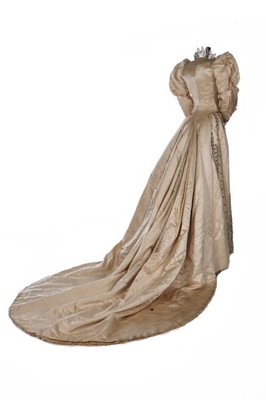 Lot 318 - A Charles Frederick Worth brocaded ivory satin...