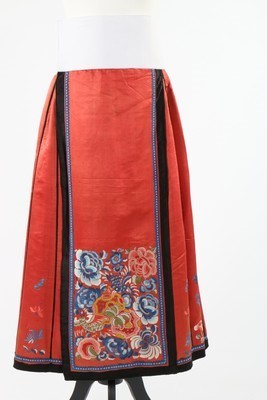 Lot 492 - An embroidered red satin skirt, Chinese, early...