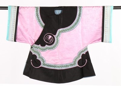 Lot 495 - A pink damask chang-fu with broad black satin...