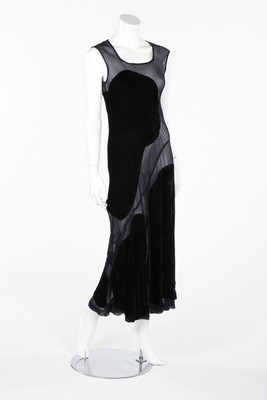 Lot 336 - A Comme des Garcons sheer navy dress with...