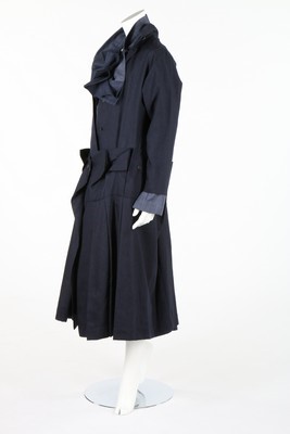 Lot 356 - An Issey Miyake navy wool dress with integral...