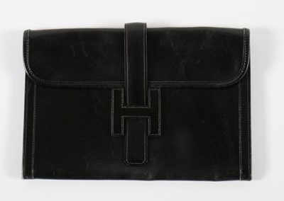 Lot 117 - An Hermès black leather 'Jige' clutch bag,...