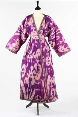 Lot 459 - A woman's purple and white ikat silk chapan,...