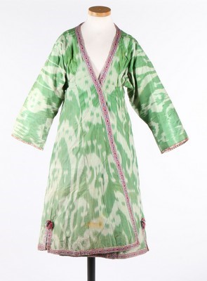 Lot 460 - A woman's green and white ikat silk chapan,...