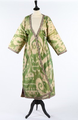 Lot 465 - A woman's ikat silk chapan, Uzbek, circa 1900,...