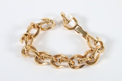 Lot 307 - A Cartier-style gold bent nail bracelet and...