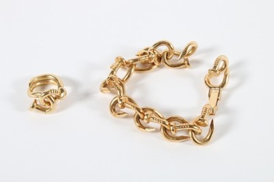 Lot 307 - A Cartier-style gold bent nail bracelet and...