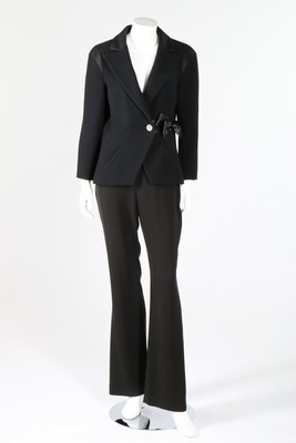 Lot 14 - A Chanel black wool jacket with satin bow to...